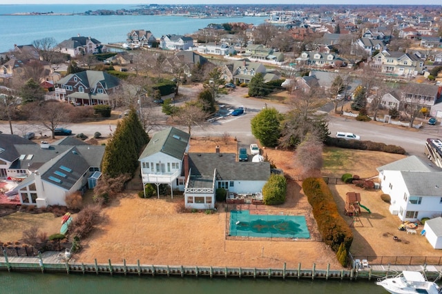 birds eye view of property featuring a water view and a residential view