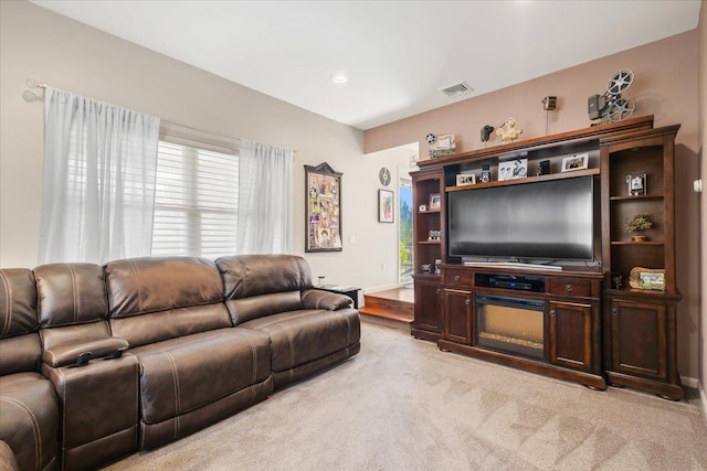 living area featuring light carpet, recessed lighting, visible vents, and baseboards