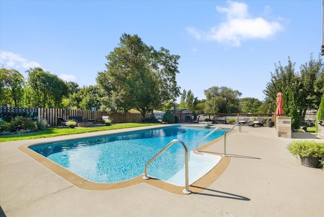 view of pool with a patio area, fence, and a fenced in pool