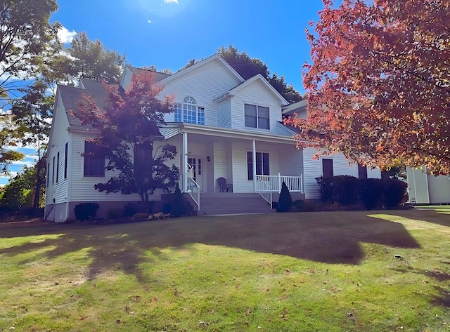 view of front of home featuring a porch and a front yard