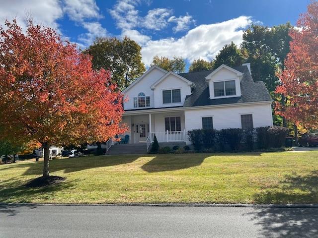 view of front of home featuring a porch and a front yard