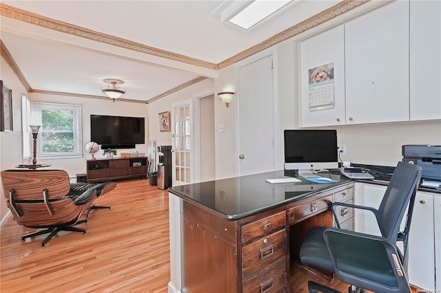 office area with light wood-type flooring and crown molding