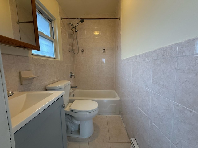 bathroom featuring toilet, tile patterned flooring, tile walls, and vanity