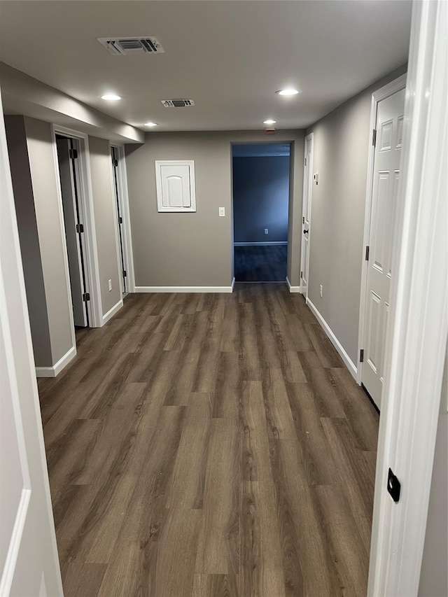 corridor featuring dark hardwood / wood-style floors