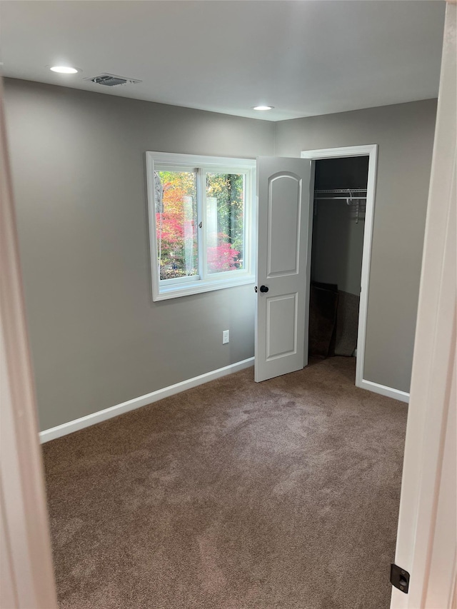 unfurnished bedroom featuring carpet floors