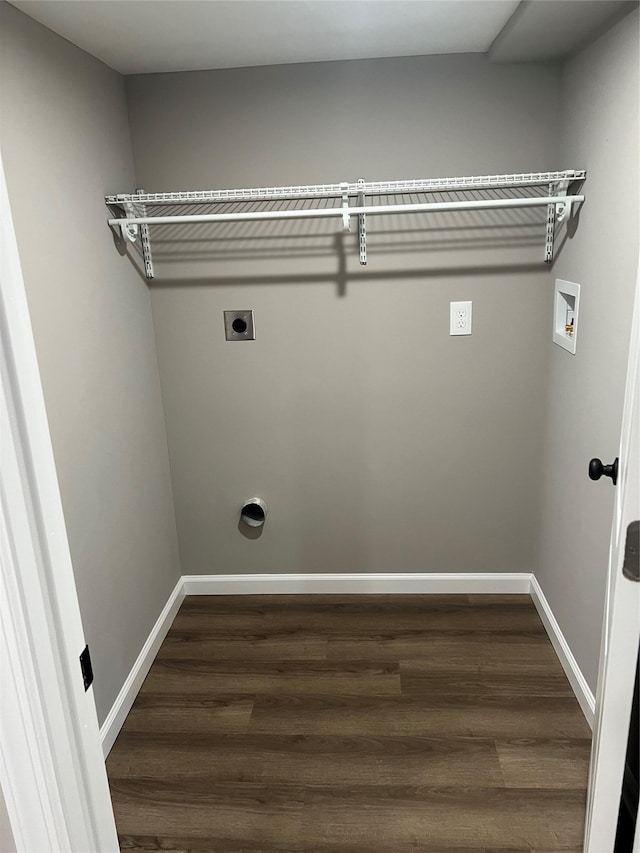 washroom featuring dark wood-type flooring, hookup for an electric dryer, and hookup for a washing machine