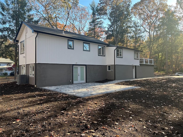 rear view of house with a patio and cooling unit