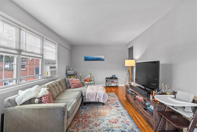 living room with baseboards and wood finished floors