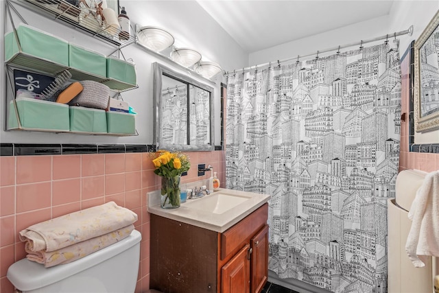 bathroom featuring a shower with curtain, tile walls, toilet, and vanity