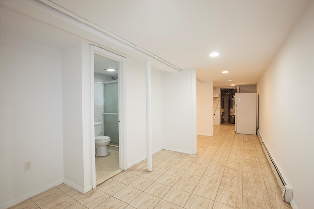 interior space featuring a baseboard radiator, baseboards, and recessed lighting