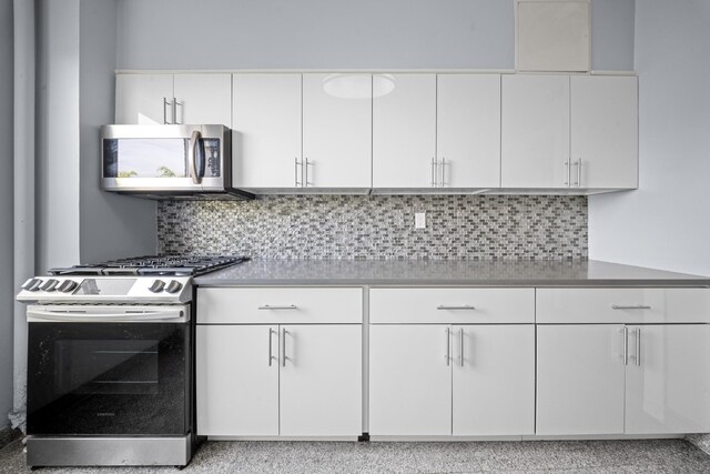 45-08 40th St Unit F32, Sunnyside, NY 11104 - kitchen with backsplash, white cabinetry, appliances with stainless steel finishes, and light countertops