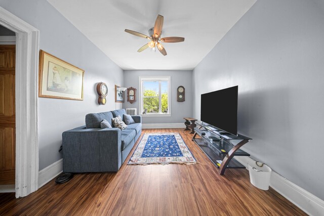 45-08 40th St Unit F32, Sunnyside, NY 11104 - living room featuring a ceiling fan, baseboards, radiator heating unit, and wood finished floors