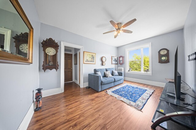 45-08 40th St Unit F32, Sunnyside, NY 11104 - living area with baseboards, a ceiling fan, and wood finished floors