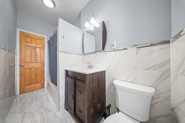 45-08 40th St Unit F32, Sunnyside, NY 11104 - full bathroom featuring vanity, toilet, shower / bath combination with curtain, marble finish floor, and tile walls