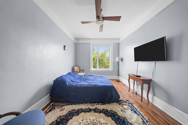 45-08 40th St Unit F32, Sunnyside, NY 11104 - bedroom with baseboards, ceiling fan, and wood finished floors