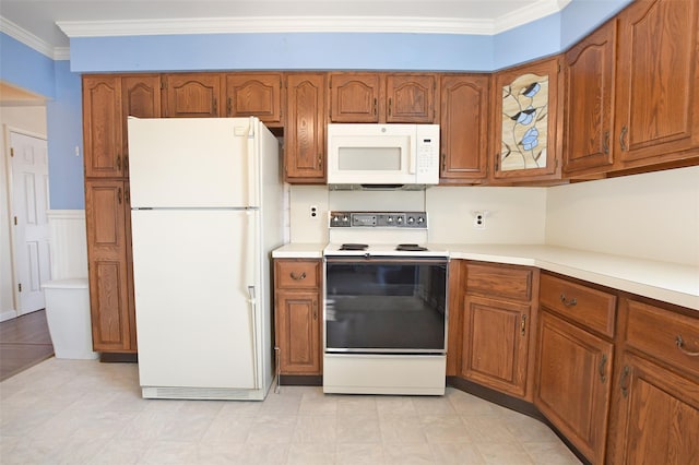 kitchen featuring crown molding, white appliances, and brown cabinets