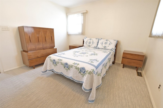 carpeted bedroom with baseboards