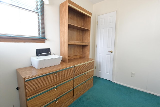 bedroom featuring carpet flooring and baseboards