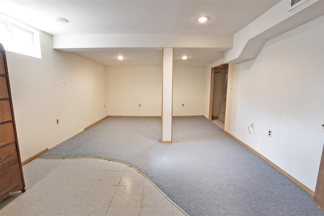 below grade area featuring visible vents, baseboards, and recessed lighting