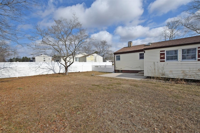 view of yard featuring a patio area and fence