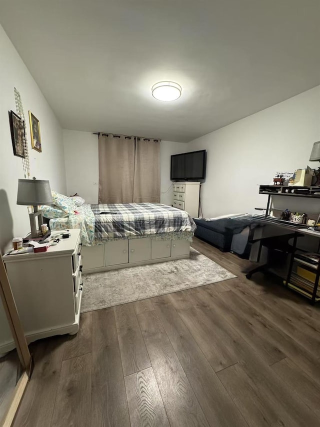 bedroom featuring dark hardwood / wood-style flooring