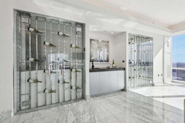 interior space with marble finish floor and a sink