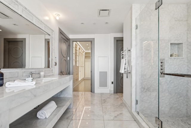 full bathroom with marble finish floor, visible vents, a shower stall, and vanity