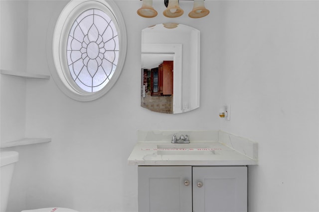 half bath with vanity and toilet