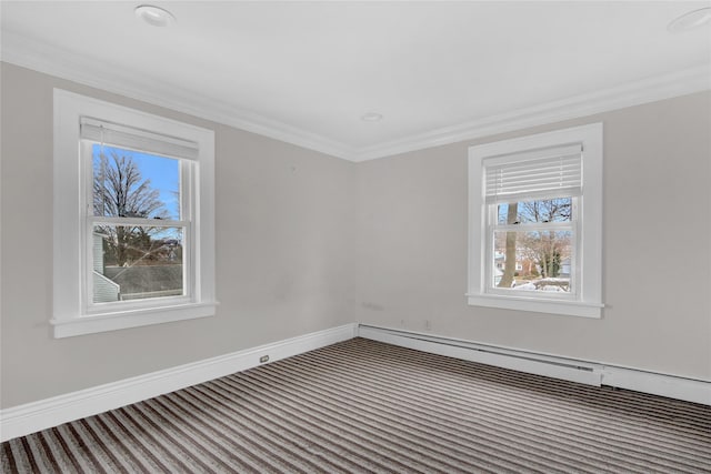 carpeted empty room with ornamental molding and baseboards