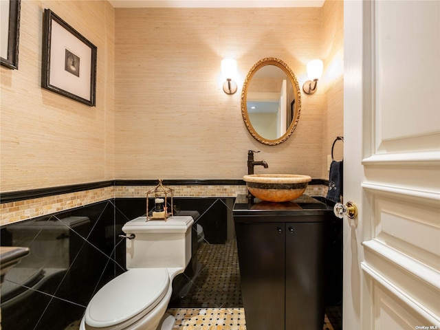 bathroom with toilet and vanity