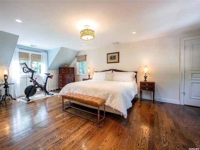 bedroom with visible vents, baseboards, dark wood-type flooring, and recessed lighting