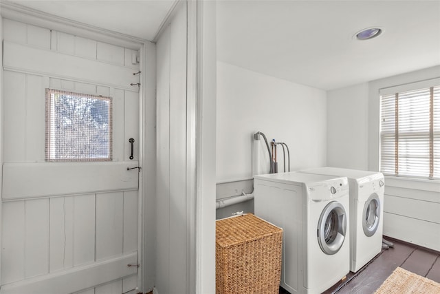 laundry room featuring separate washer and dryer and dark hardwood / wood-style floors