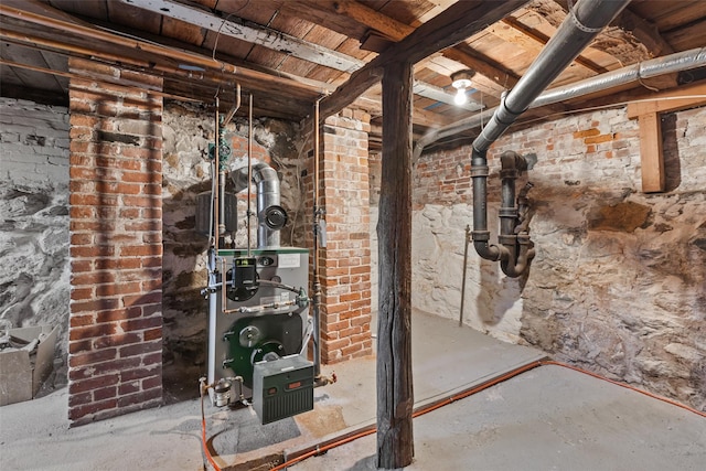 basement featuring brick wall