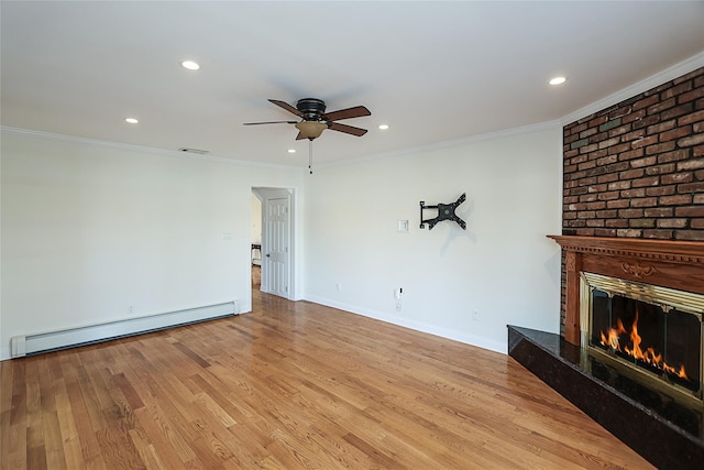 unfurnished living room with baseboard heating, crown molding, a ceiling fan, and wood finished floors