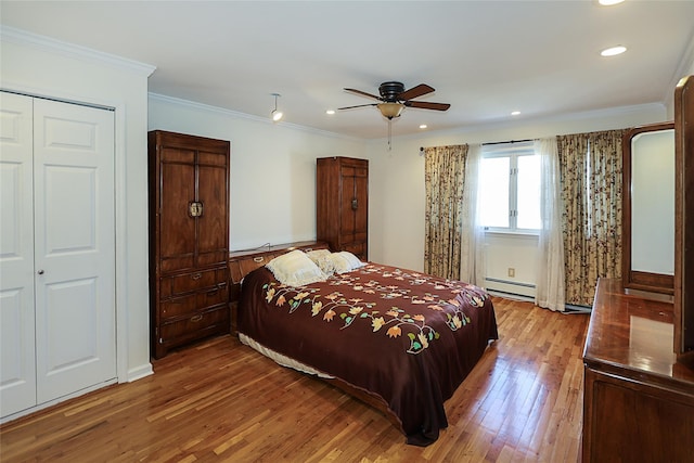 bedroom with ornamental molding, a ceiling fan, wood finished floors, recessed lighting, and a baseboard radiator