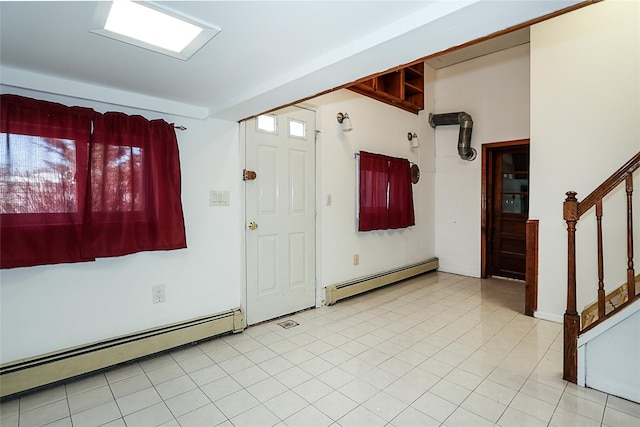 entryway featuring stairs and a baseboard radiator