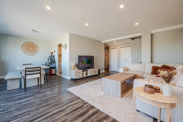 living area featuring recessed lighting, stairway, baseboards, and wood finished floors