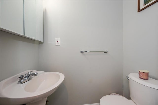 bathroom with a sink and toilet