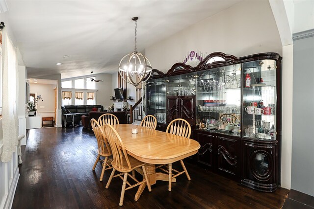 59 Lauren Ave, Dix Hills, NY 11746 - dining room with lofted ceiling, ceiling fan with notable chandelier, indoor bar, stairway, and wood-type flooring