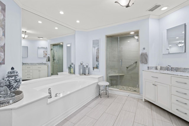 bathroom featuring a stall shower, visible vents, a sink, crown molding, and a bath