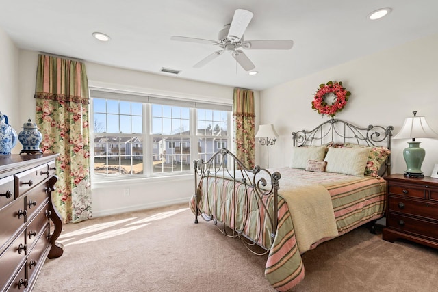 bedroom with carpet floors, a ceiling fan, visible vents, and recessed lighting