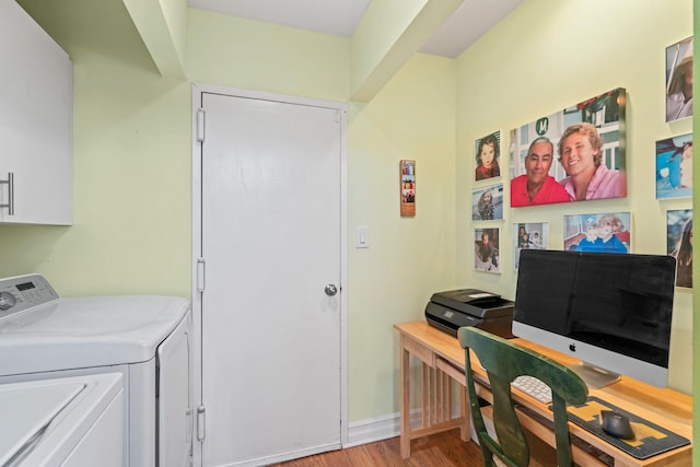 interior space with washer and clothes dryer and wood finished floors