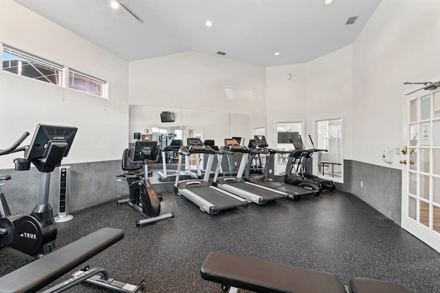 gym with high vaulted ceiling and visible vents