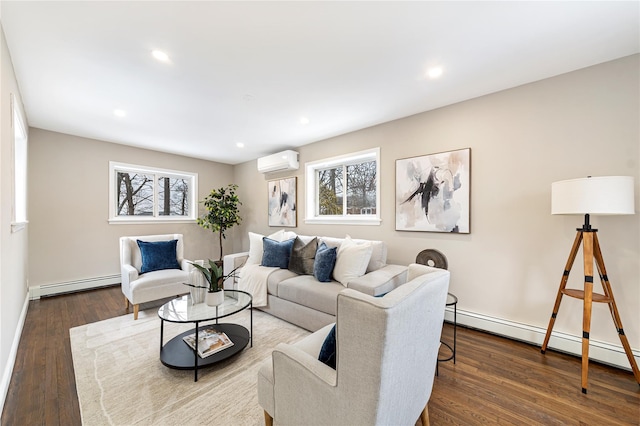 living area featuring a wall unit AC, a healthy amount of sunlight, baseboard heating, and dark wood-type flooring