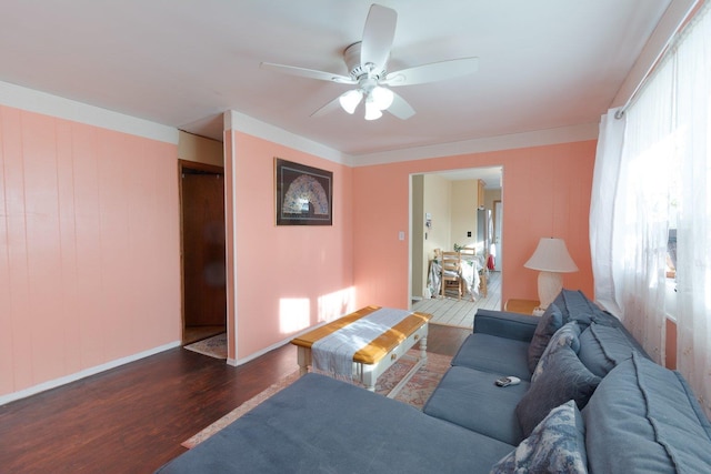 203 Front Ave, Brentwood, NY 11717 - living room featuring ceiling fan, dark wood-type flooring, and baseboards