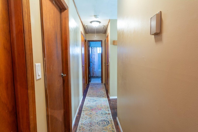 203 Front Ave, Brentwood, NY 11717 - hallway featuring attic access and baseboards