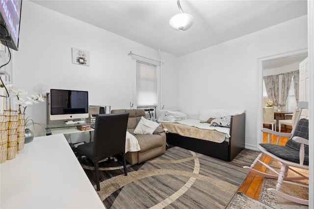 bedroom with wood finished floors