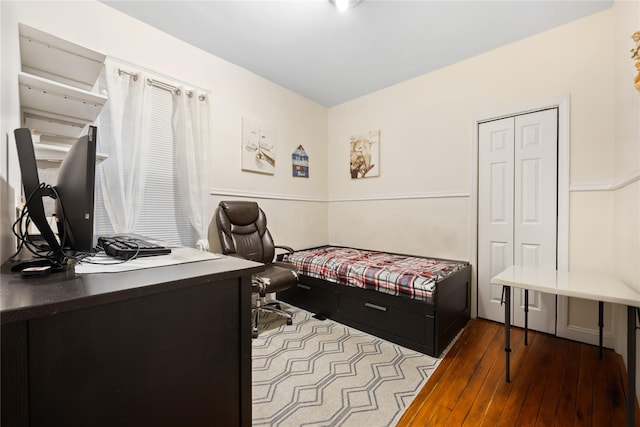 bedroom with wood finished floors