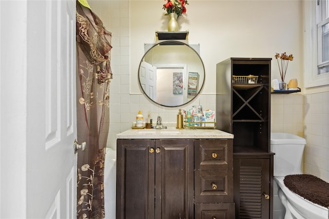 full bathroom featuring toilet, curtained shower, tile walls, and vanity