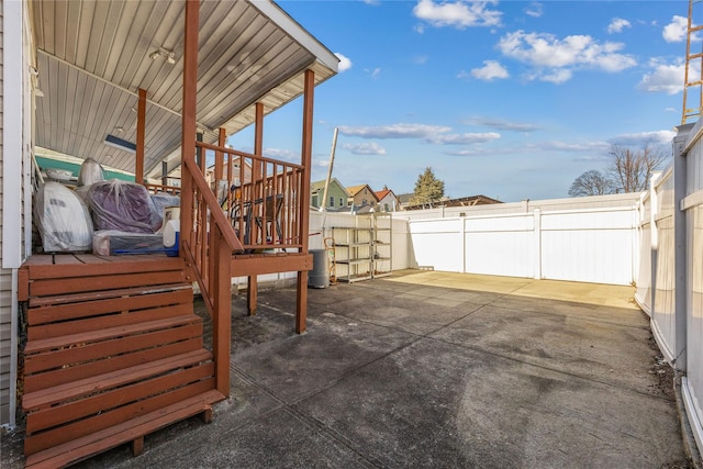 view of patio featuring fence